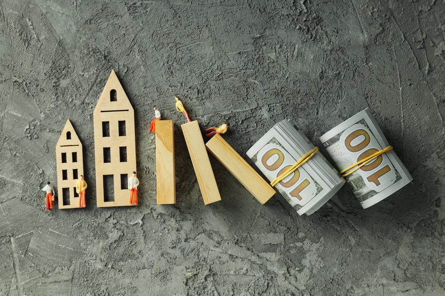 Homeowner reviewing a bridge loan vs home equity loan cost breakdown on a tablet