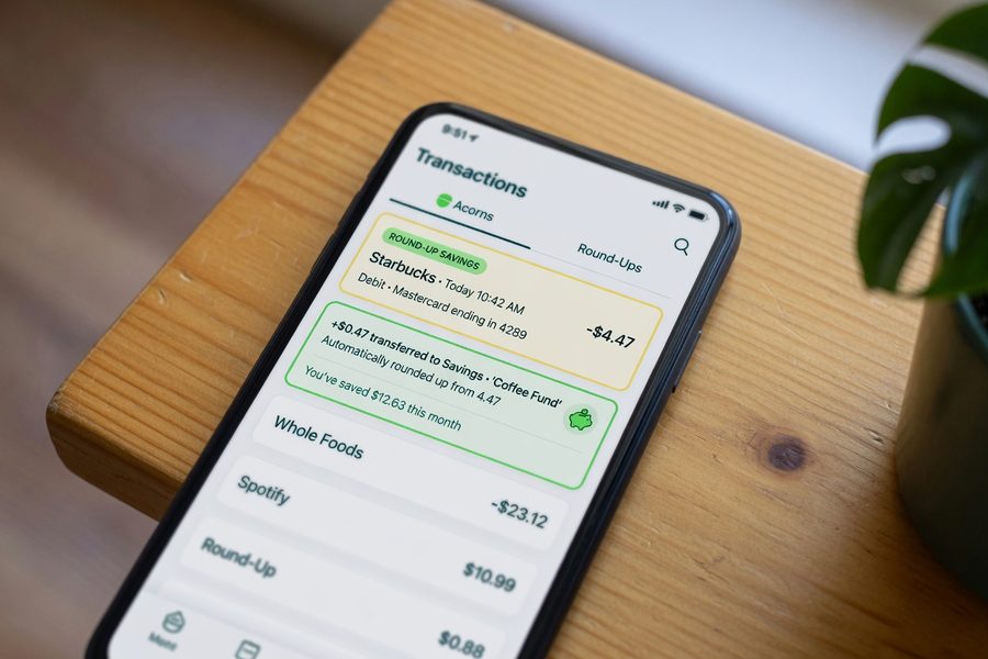 Smartphone screen showing automatic savings transfer setup in a banking app
