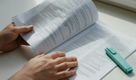Freelancer reviewing health insurance plan options on laptop at home office