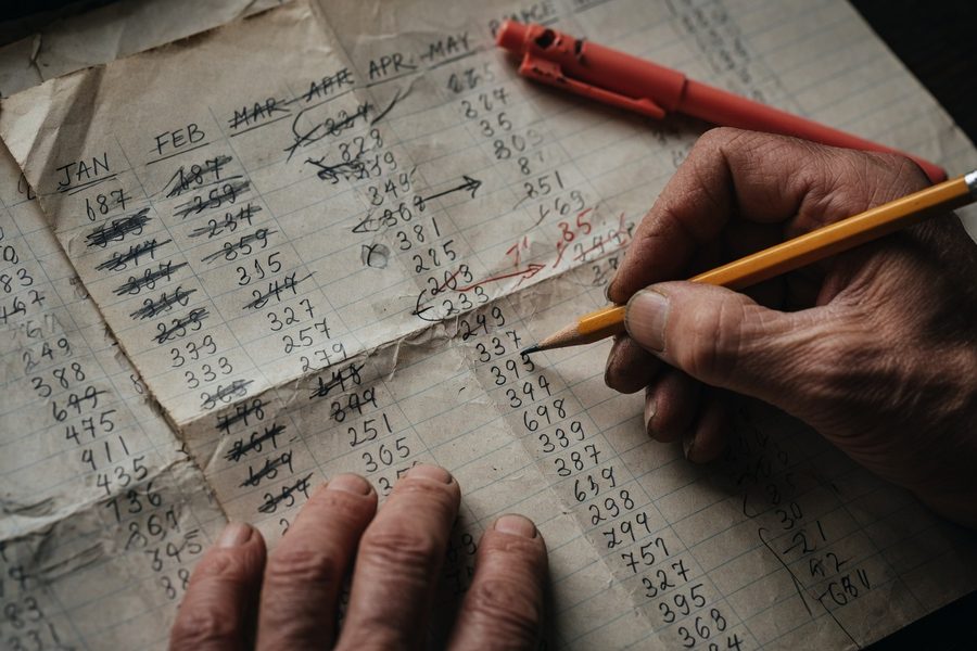 Person reviewing retirement account statements and a post-divorce financial plan