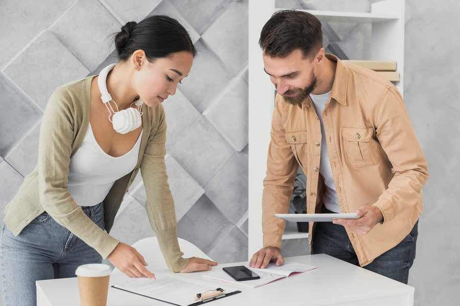 Woman reviewing credit report with partner
