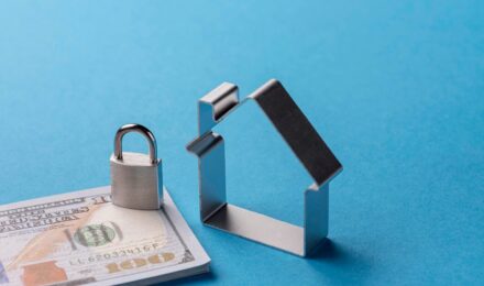 Homebuyer reviewing mortgage rate lock and float options with lender paperwork on table