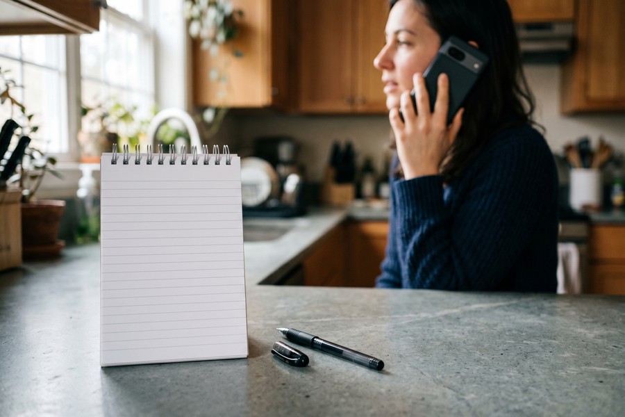 Patient reviewing a Good Faith Estimate document at a hospital billing desk