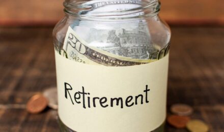Older couple reviewing retirement budget and financial documents at home