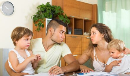 Parent with child reviewing 2025 tax documents and child tax credit information