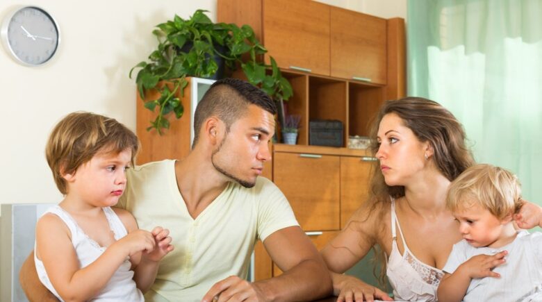 Parent with child reviewing 2025 tax documents and child tax credit information