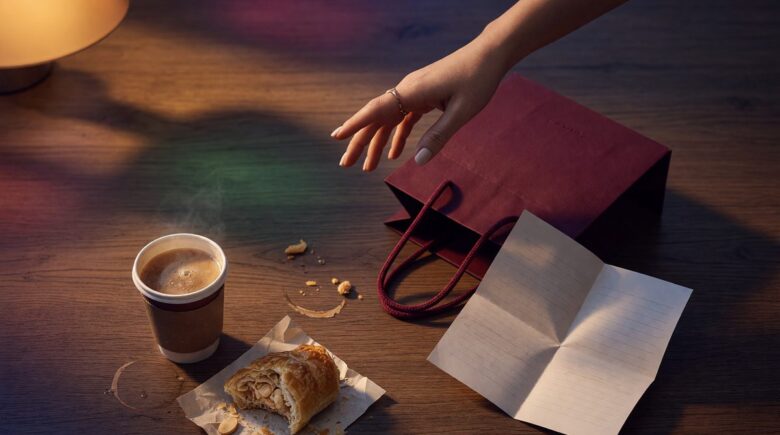 Person holding shopping bags, looking conflicted about their purchase decisions