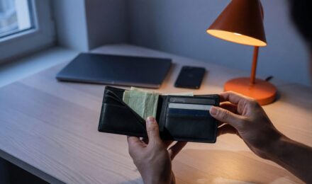Minimalist wallet and financial accounts representing consolidated finances and reduced subscriptions