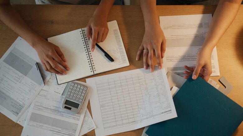 Couple reviewing financial documents and planning together at a desk