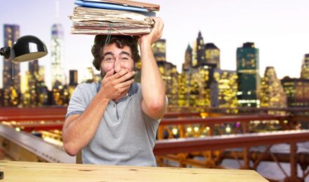 A landlord reviewing tax documents and digital records for rental income reporting in New York