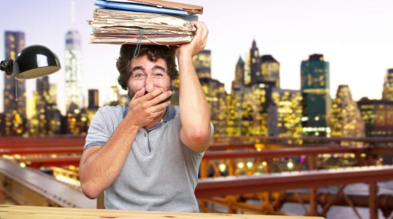 A landlord reviewing tax documents and digital records for rental income reporting in New York