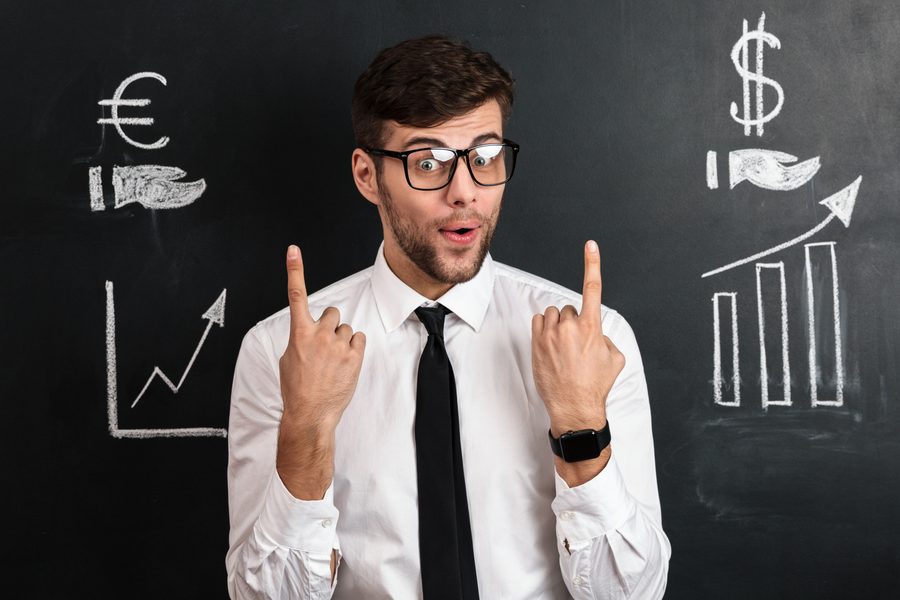 Young investor looking at graph on phone with worried expression