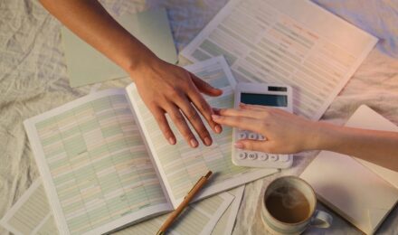 Couple reviewing joint budget together at home