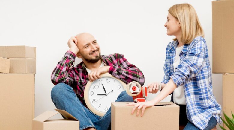 Calculator and moving boxes representing mid-year state relocation tax planning