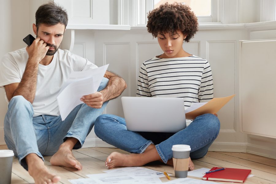 A lender comparing down payment options for the same home price.