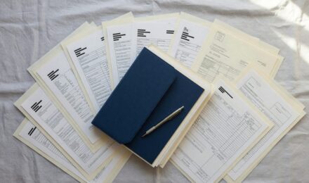 Organized financial documents and checklist for mortgage pre-approval application