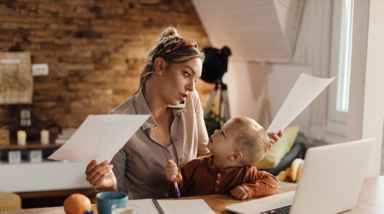 Single mom at laptop reviewing investment portfolio and monthly budget on $48,000 salary
