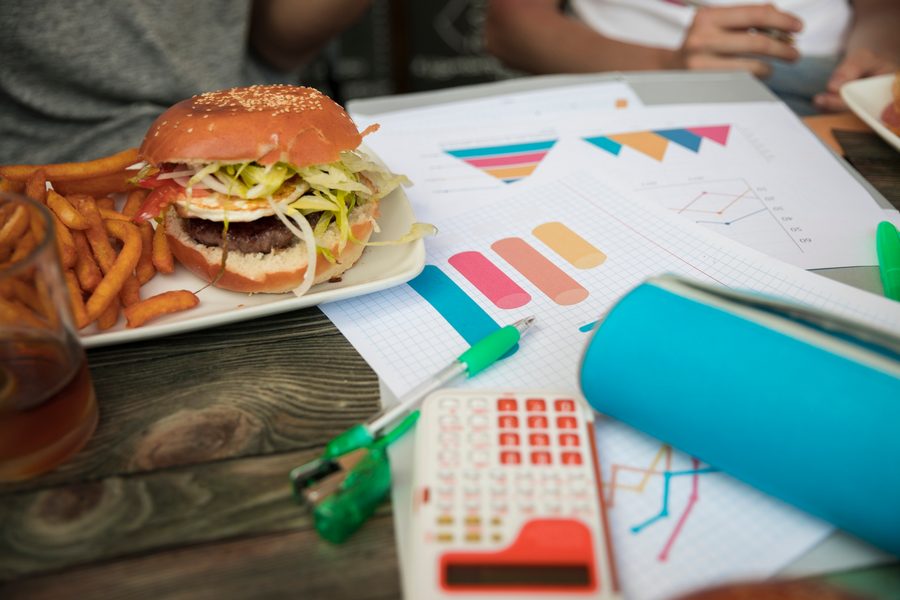 Bar chart comparing cost per meal: home-cooked versus restaurant versus delivered
