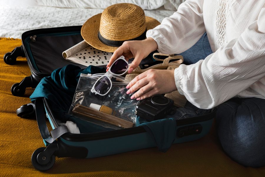 Traveler comparing two credit cards at an airport lounge check-in counter