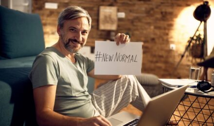 Person reviewing Social Security benefits information with a calculator and retirement planning guide