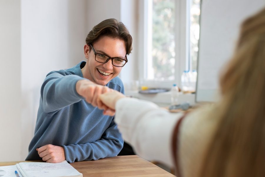 Person reviewing monthly payment calculator comparing loan and credit card payoff timelines